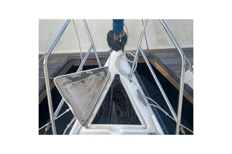 Slide: The Image of Bow of 1987 Newport 30-3 sailboat with anchor and ropes. - 22
