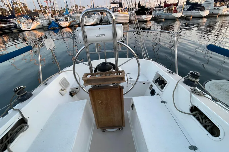 Slide: The Image of Cockpit of a 1987 Newport 30-3 sailboat docked in a marina. - 5