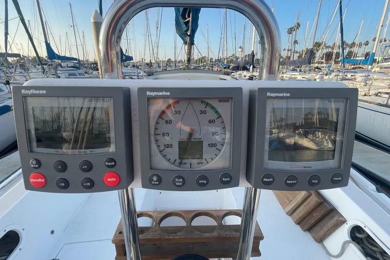 Slide: The Image of Cockpit of 1987 Newport 30-3 sailboat with Raytheon and Raymarine navigation instruments. - 7