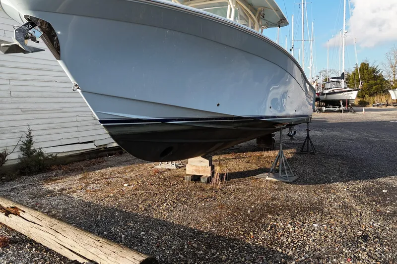 Slide: The Image of 2017 Grady-White Canyon 336 boat on dry dock, side view. - 12