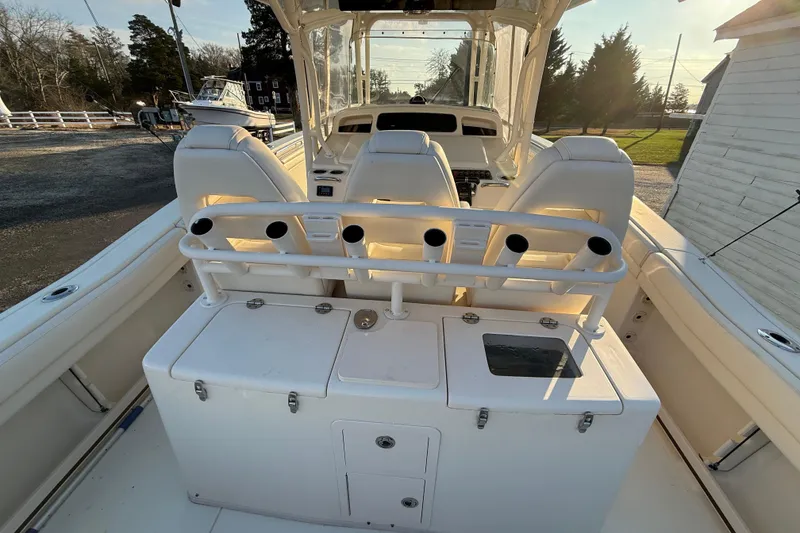 Slide: The Image of 2017 Grady-White Canyon 336 boat interior with rod holders and seating. - 16