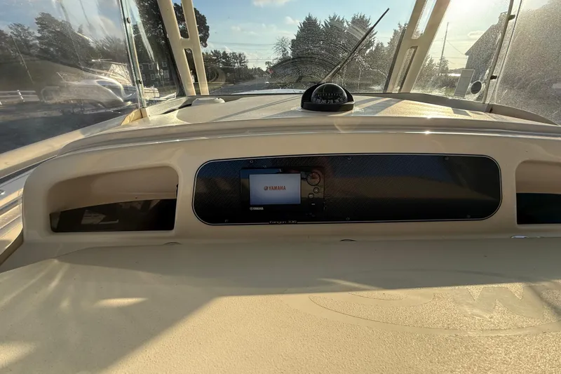 Slide: The Image of 2017 Grady-White Canyon 336 dashboard with Yamaha display and compass. - 30