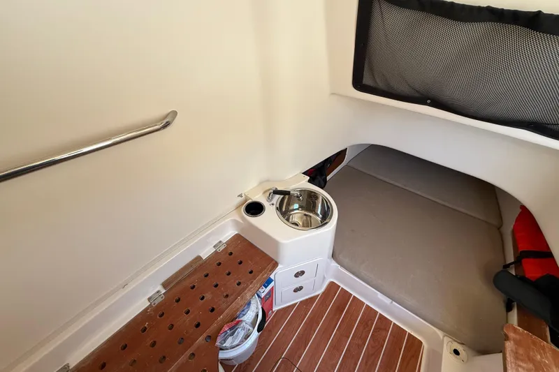 Slide: The Image of 2017 Grady-White Canyon 336 cabin interior with sink and wooden flooring. - 41