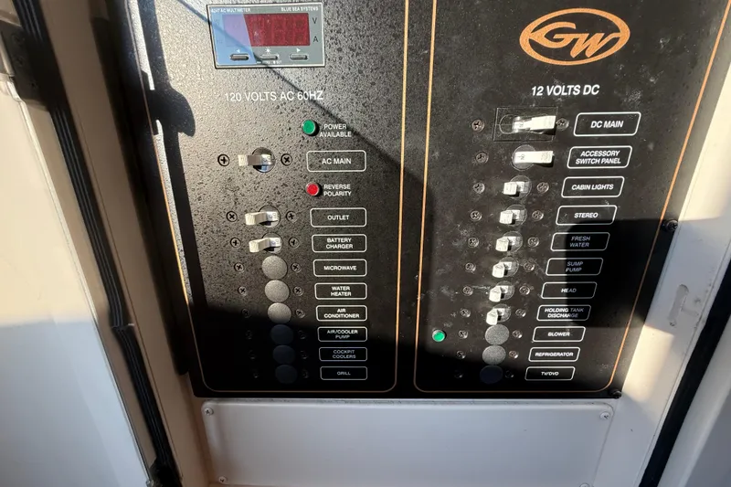 Slide: The Image of Electrical control panel on a 2017 Grady-White Canyon 336 boat. - 44