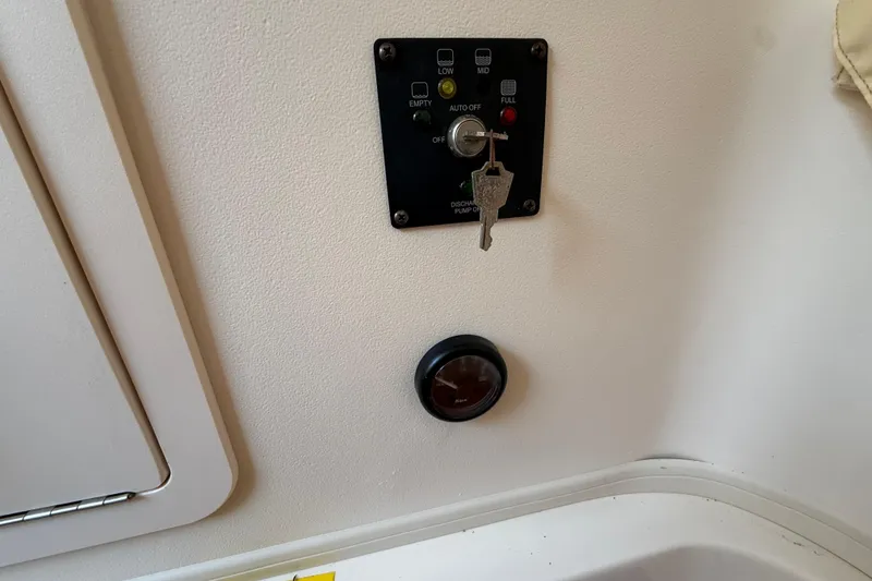 Slide: The Image of Control panel with key on a 2017 Grady-White Canyon 336 boat. - 46