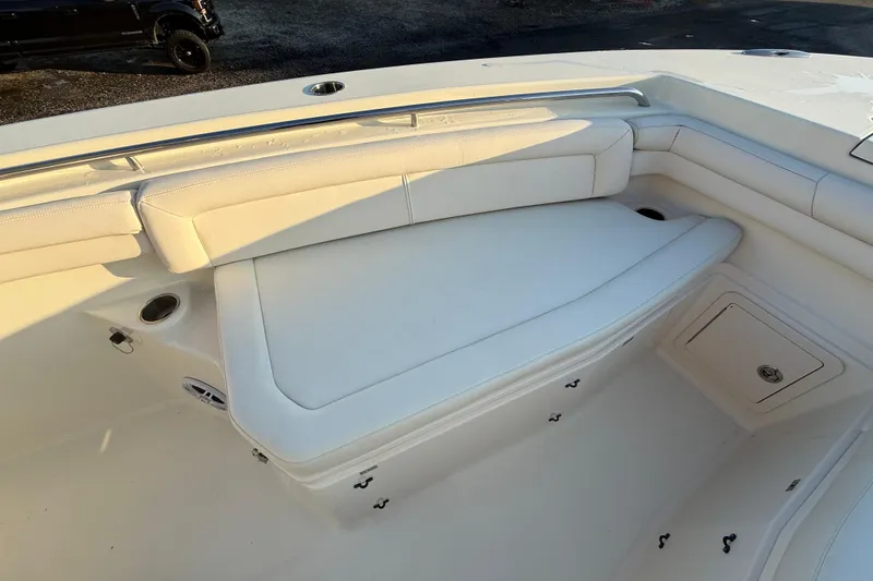 Slide: The Image of 2017 Grady-White Canyon 336 boat interior with white cushioned seating. - 48