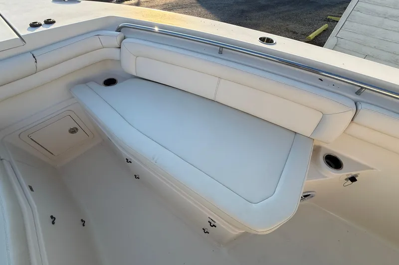 Slide: The Image of 2017 Grady-White Canyon 336 boat interior with white cushioned seating. - 49