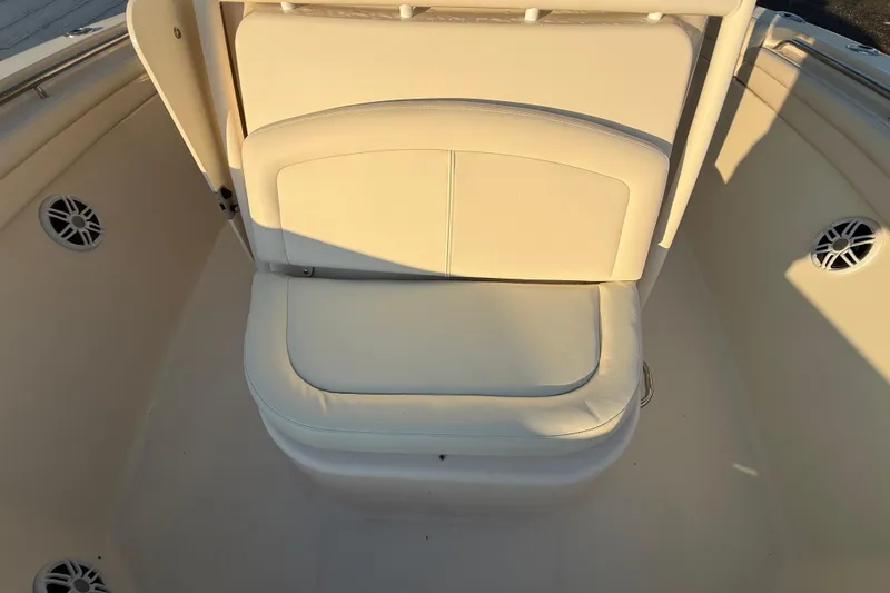 Slide: The Image of 2017 Grady-White Canyon 336 boat seating area with white cushioned seat. - 50