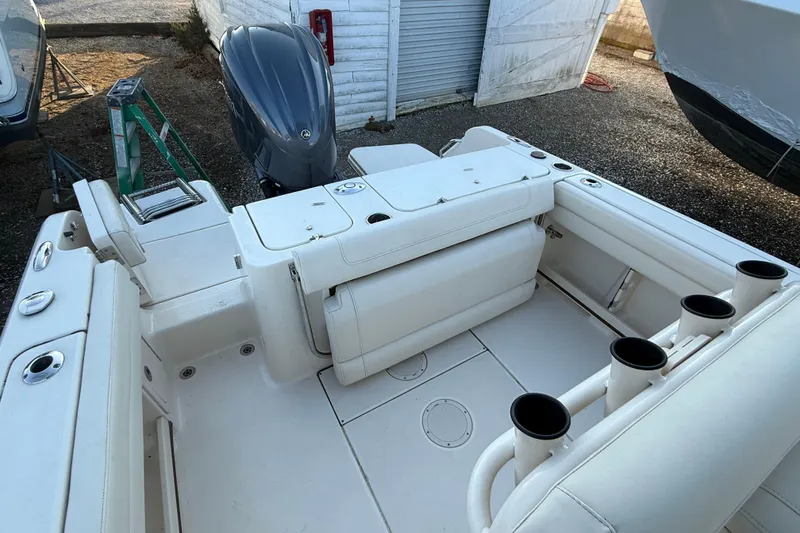 Slide: The Image of 2023 Grady-White Fisherman 236 boat interior with seating and rod holders. - 10