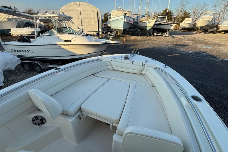 Slide: The Image of 2023 Grady-White Fisherman 236 boat with spacious seating in a marina setting. - 17