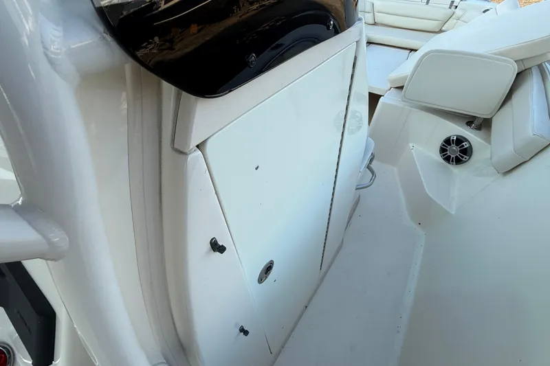 Slide: The Image of 2023 Grady-White Fisherman 236 boat interior with seating and storage compartment. - 20