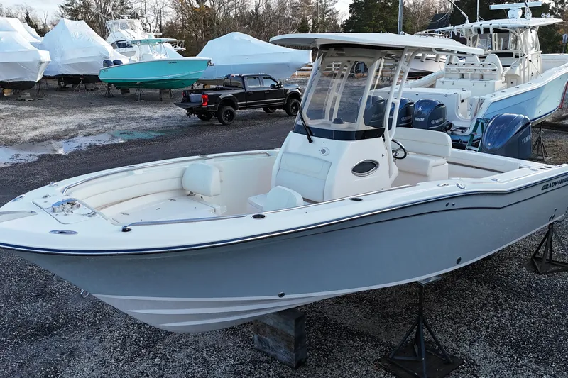 Slide: The Image of 2023 Grady-White Fisherman 236 boat displayed in a marina with other vessels. - 4