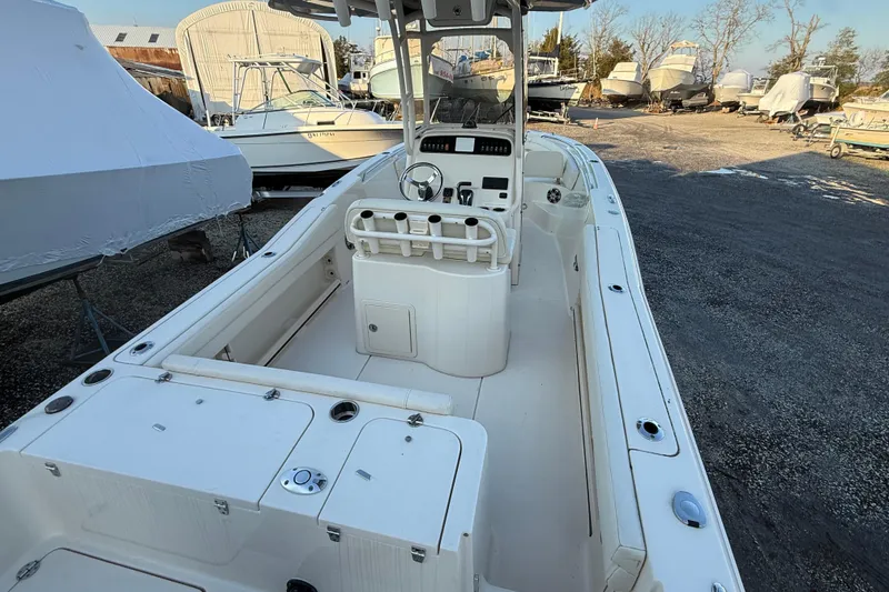 Slide: The Image of 2023 Grady-White Fisherman 236 boat, spacious deck, parked in a marina. - 9
