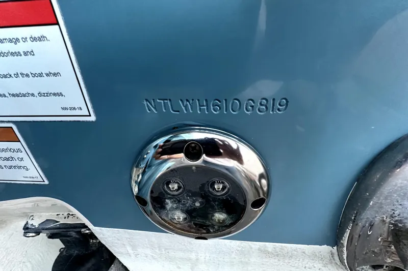 Slide: The Image of 2019 Grady-White Canyon 336 boat hull identification number and warning labels. - 10