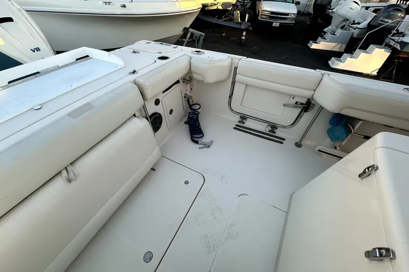 Slide: The Image of 2019 Grady-White Canyon 336 boat interior with seating and storage compartments. - 11
