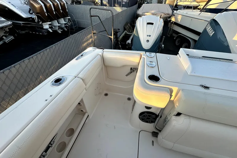 Slide: The Image of 2019 Grady-White Canyon 336 boat interior with seating and Yamaha V8 engine. - 31