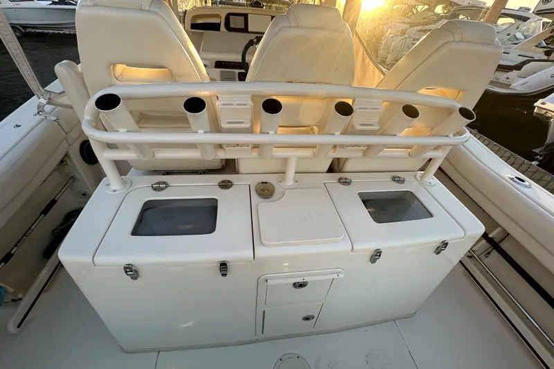 Slide: The Image of 2019 Grady-White Canyon 336 boat interior with rod holders and storage compartments. - 32