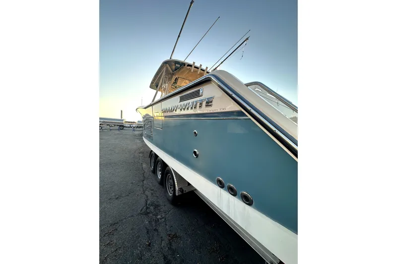 Slide: The Image of 2019 Grady-White Canyon 336 boat on trailer, side view at sunset. - 4