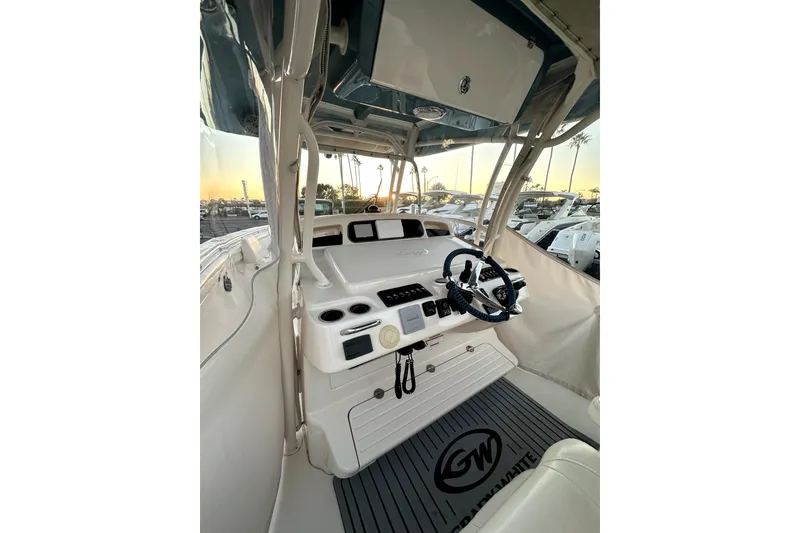 Slide: The Image of 2019 Grady-White Canyon 336 boat interior with steering wheel and control panel. - 41