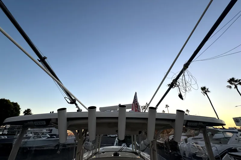 Slide: The Image of 2019 Grady-White Canyon 336 boat with fishing rod holders at sunset. - 43