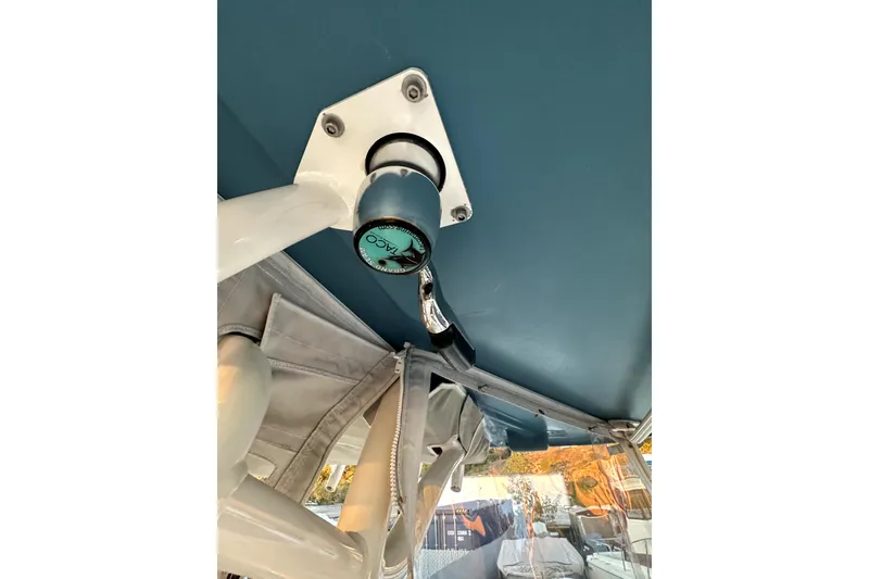 Slide: The Image of 2019 Grady-White Canyon 336 boat detail, featuring a mounted rod holder. - 48
