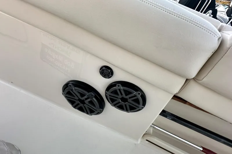 Slide: The Image of 2019 Grady-White Canyon 336 boat interior with speakers and cushioned seating. - 52