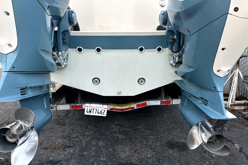 Slide: The Image of Rear view of 2019 Grady-White Canyon 336 boat with dual outboard motors. - 55