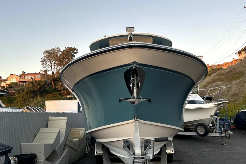 Slide: The Image of 2019 Grady-White Canyon 336 boat on trailer, front view, outdoor setting. - 58