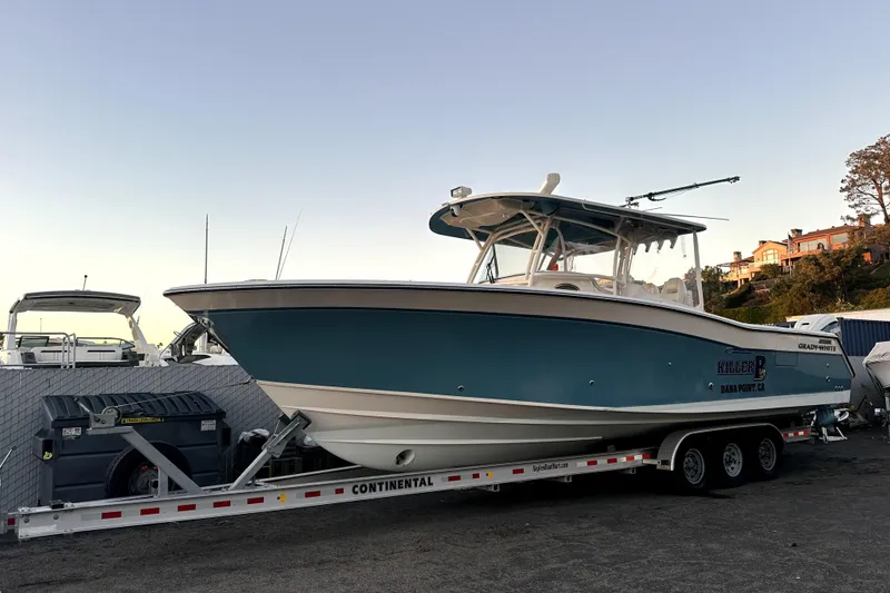 Slide: The Image of 2019 Grady-White Canyon 336 boat on trailer, parked outdoors. - 61