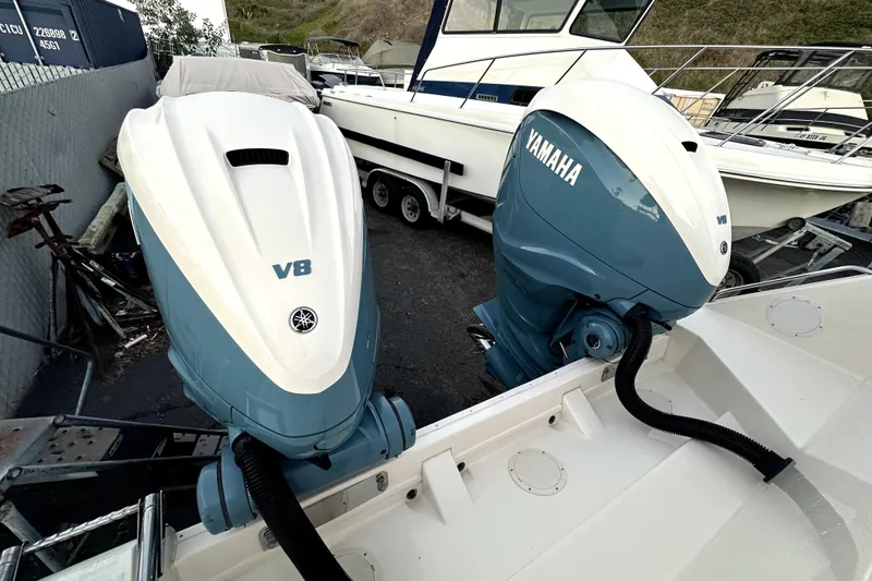 Slide: The Image of 2019 Grady-White Canyon 336 with twin Yamaha V8 outboard engines in a boatyard. - 68