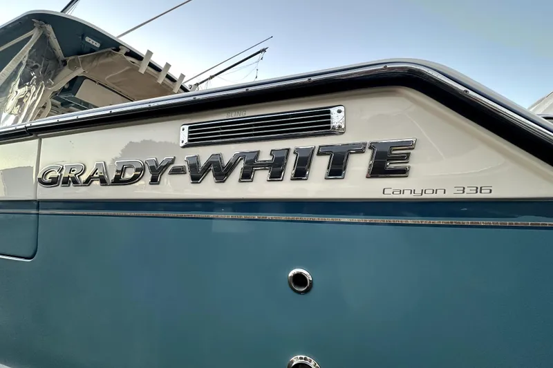 Slide: The Image of 2019 Grady-White Canyon 336 boat, close-up of logo and model name. - 70
