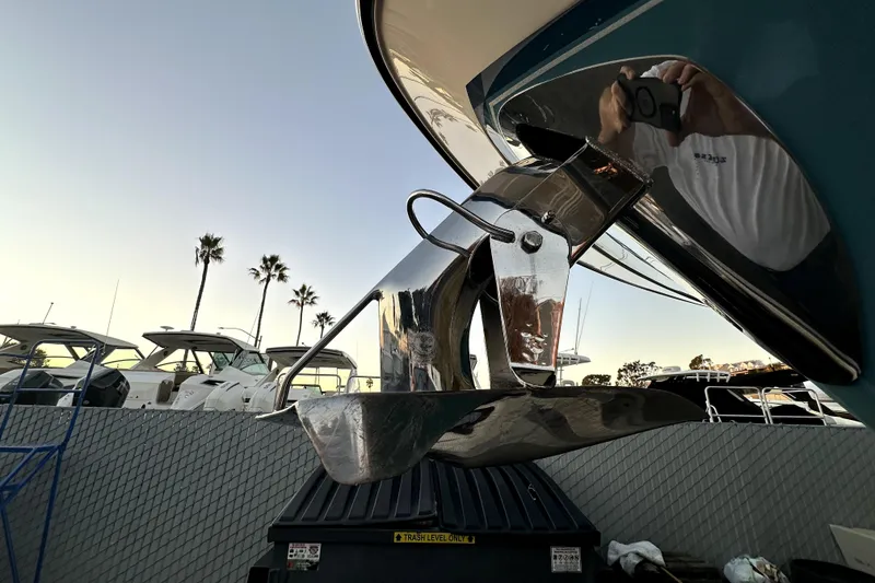 Slide: The Image of 2019 Grady-White Canyon 336 boat anchor with palm trees in the background. - 79