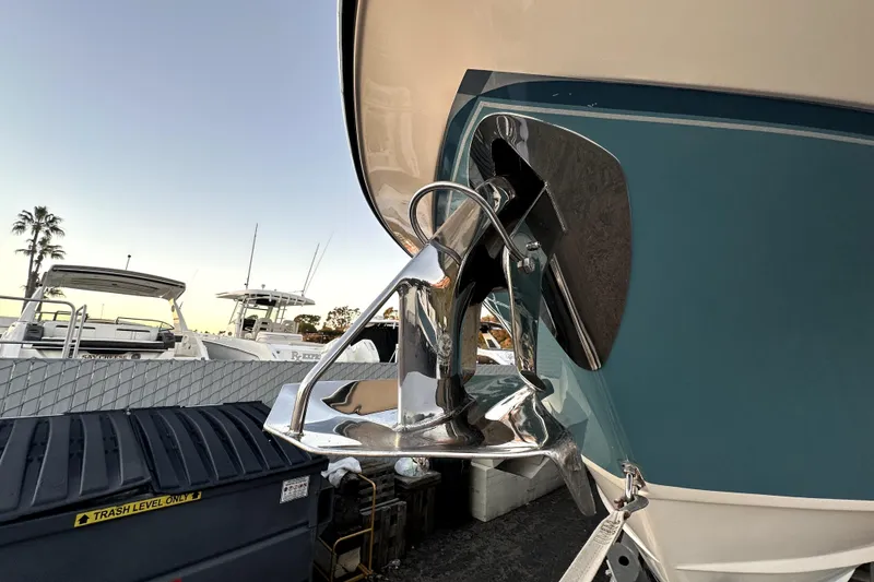 Slide: The Image of 2019 Grady-White Canyon 336 boat anchor detail with marina background. - 80