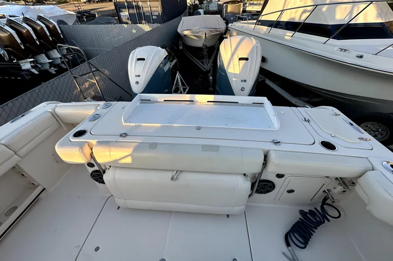 Slide: The Image of 2019 Grady-White Canyon 336 boat deck with Yamaha V8 engines in marina. - 9