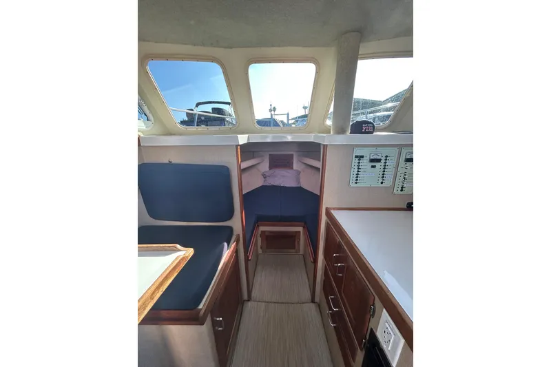 Slide: The Image of Interior of 1998 Blackman Billfisher 26 boat with seating and control panels. - 13