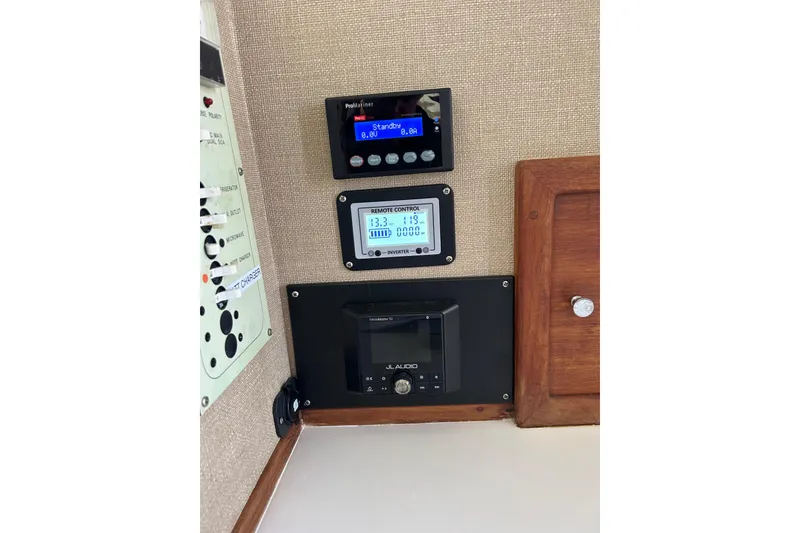 Slide: The Image of Control panel of a 1998 Blackman Billfisher 26 boat with electronic displays. - 17