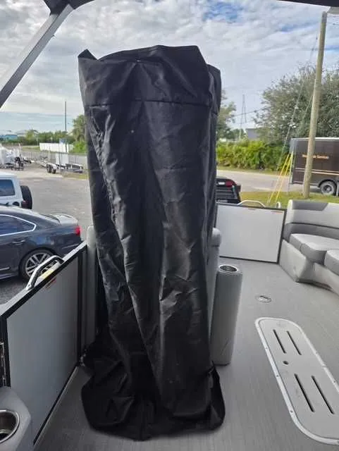 Slide: The Image of 2020 Veranda VTX22RC boat interior with covered equipment, outdoor setting. - 8