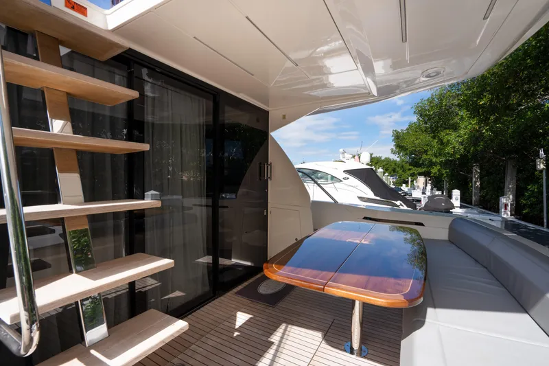 Slide: The Image of Luxurious 2018 Ferretti Yachts 450 flybridge with elegant outdoor seating and table. - 1