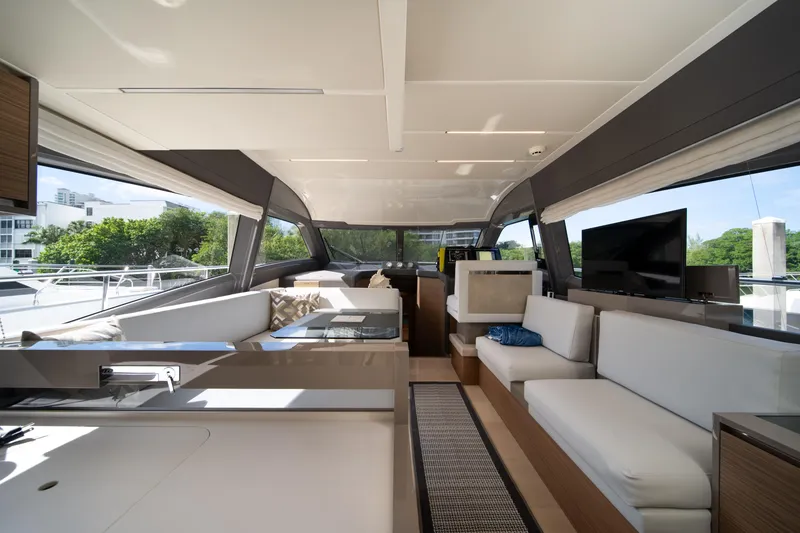 Slide: The Image of Luxurious interior of 2018 Ferretti Yachts 450 fly with modern furnishings and panoramic windows. - 10