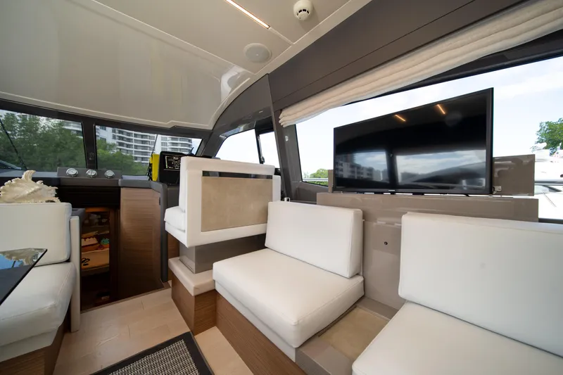 Slide: The Image of Luxurious interior of 2018 Ferretti Yachts 450 fly with modern seating and large TV. - 13
