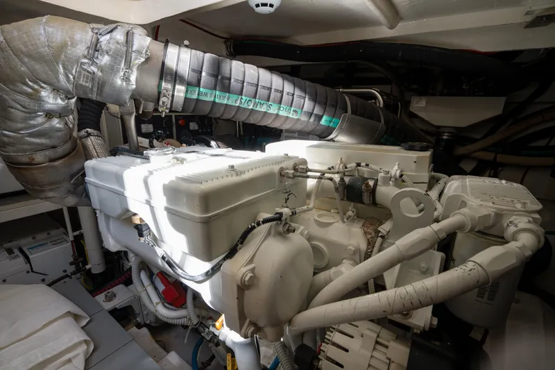 Slide: The Image of Engine room of 2018 Ferretti Yachts 450 fly, showcasing mechanical components and piping. - 24