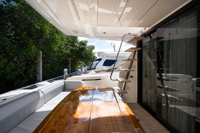 Slide: The Image of Luxurious 2018 Ferretti Yachts 450 flybridge with elegant outdoor seating and staircase. - 5