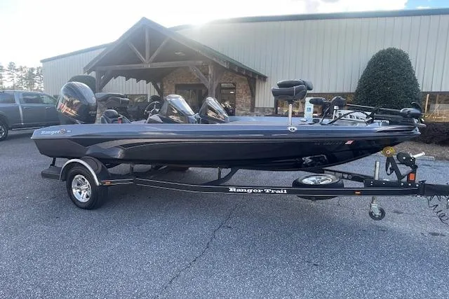 Slide: The Image of 2020 Ranger 107 Cherokee boat on trailer, parked outdoors near a building. - 3