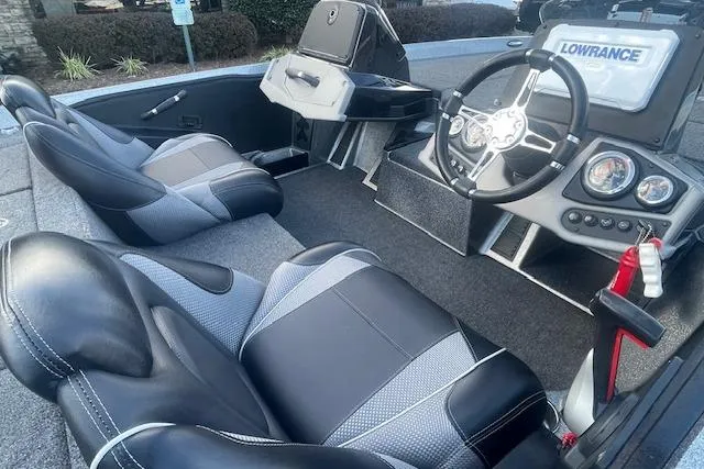 Slide: The Image of Interior of a 2020 Ranger 107 Cherokee boat with modern dashboard and seating. - 5
