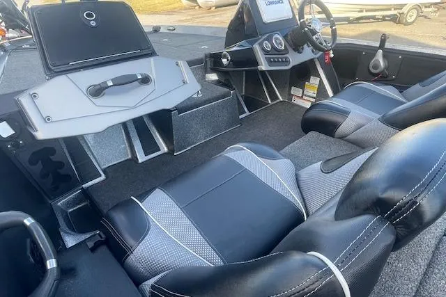 Slide: The Image of Interior of 2020 Ranger 107 Cherokee boat with modern seating and dashboard controls. - 7