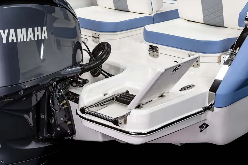 Slide: The Image of 2026 Chaparral 250 OSX boat interior with compact marine toilet and storage. - 13