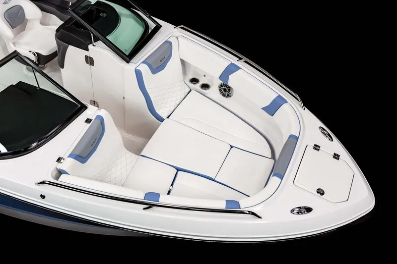 Slide: The Image of 2026 Chaparral 250 OSX boat interior with seating, table, and blue LED lights. - 5