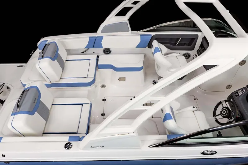 Slide: The Image of 2026 Chaparral 250 OSX boat interior with sleek seating and modern dashboard design. - 8