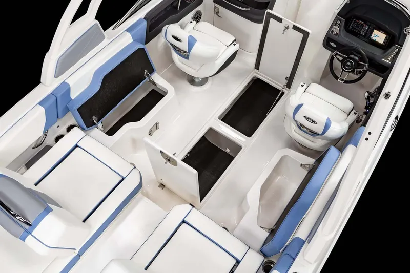 Slide: The Image of 2026 Chaparral 250 OSX boat interior with gray seating and round table. - 9