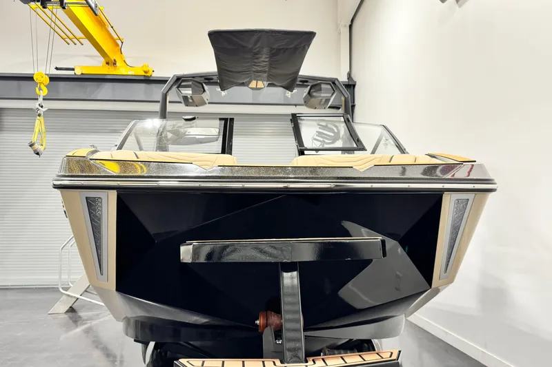 Slide: The Image of 2025 Nautique Super Air Nautique G21 boat in showroom, front view. - 3